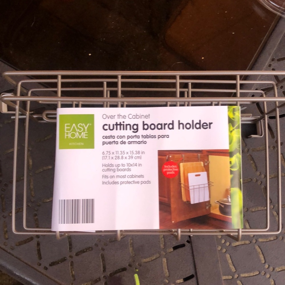 Over the cabinet cutting board holder